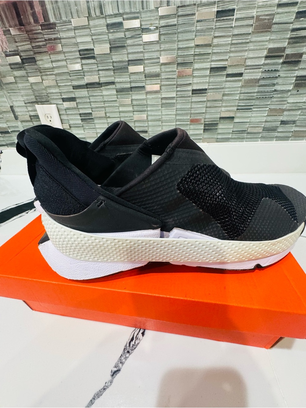 Nike Women’s Black and White Slip-On Mesh Sneakers